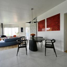 Modern living room with dining area.