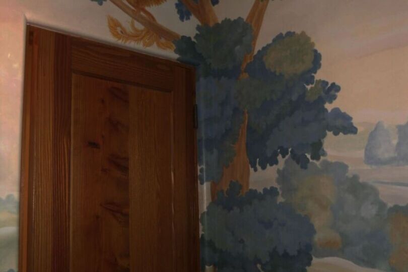 Mural of a tree and a phoenix.