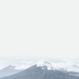 Mountain landscape with clouds and mist.