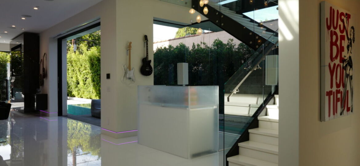 Modern interior with guitars and artwork.